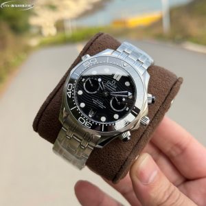 Alternative view of TVS-Omega OMEGA OT New Seamaster 300M 44mm Chronograph Watch TVS Factory1-1 Exclusive In-House Developed 9900 Movement with Identical Functions to Original, Dual-T Black Balance Wheel Movement.3 o'clock position features 12-hour and 60-minute chronograph subdials. 1: Brand-new Seamaster 300M ceramic dial with distinct lines and translucent gloss. 2: Case sandblasting exhibits fine, consistent lines matching the original without broken patterns. Authentic conical exhaust valve. Bezel rotation produces crisp, smooth sound.3: The ceramic bezel's markings and text utilize "white enamel" technology, resisting yellowing to maintain a pure white luster with brighter lettering.          4: The high-precision 9-link steel bracelet undergoes meticulous polishing on each link to ensure flawless assembly. The adjustable end links provide a snug fit, while the extended clasp offers enhanced comfort and is interchangeable with the original. "TVS Craftsmanship: Guaranteed Excellence" Exquisitely recommended multifunctional mechanical wristwatch for men.